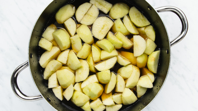 peeled chopped apples in pot