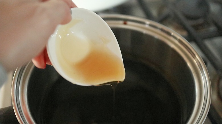 honey pouring into pan