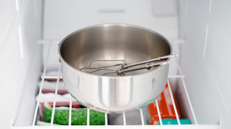 a metal bowl chilling in freezer