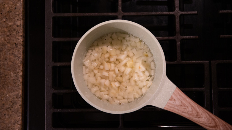 diced pear cooking in saucepan 