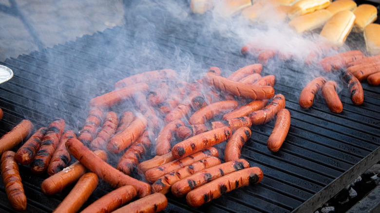 Grill covered in hot dogs