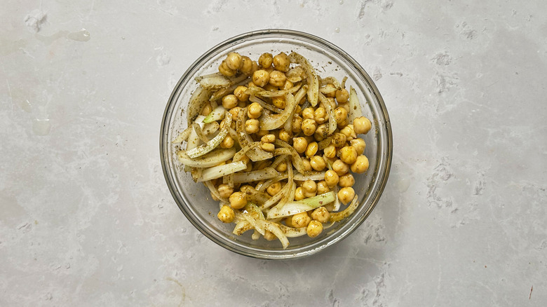 seasoning chickpeas in bowl