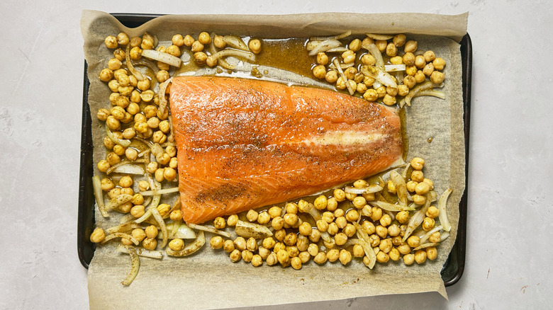 chickpeas and salmon on baking sheet