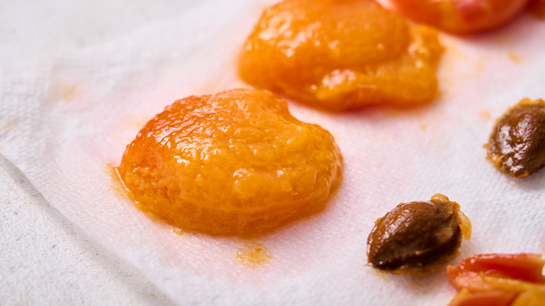 skinned apricots on paper towel