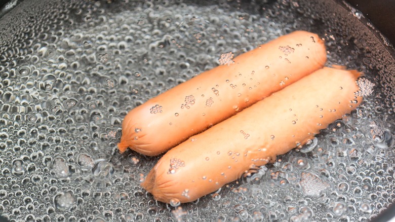 two sausages in boiling water