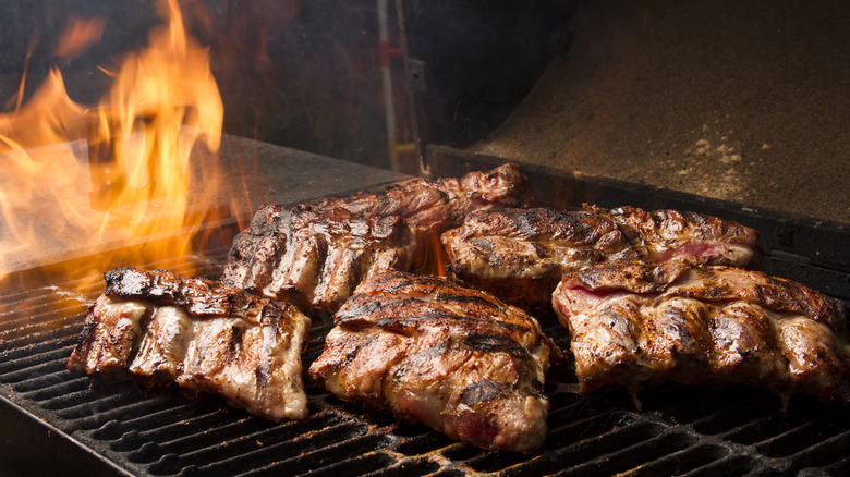 barbecue cooking over flame