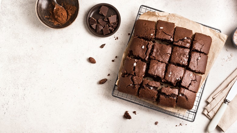 brownies on cooling rack with chocolate