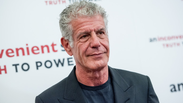 Anthony Bourdain poses at event  