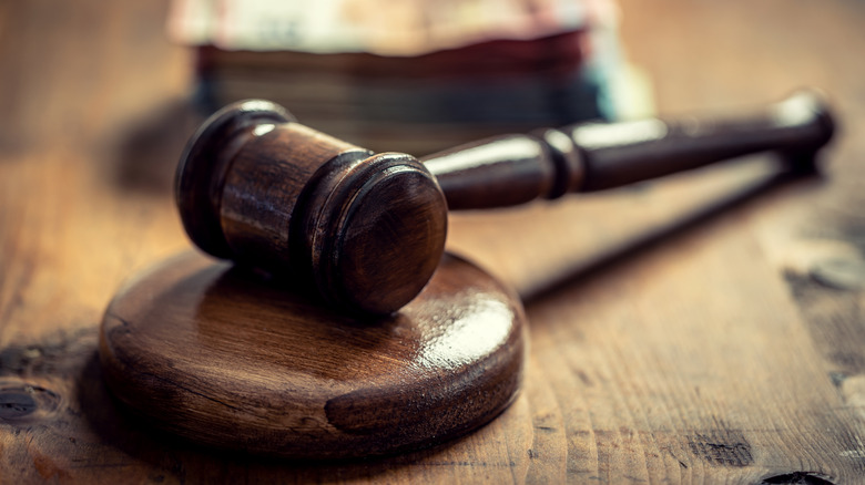 a wooden gavel on a desk