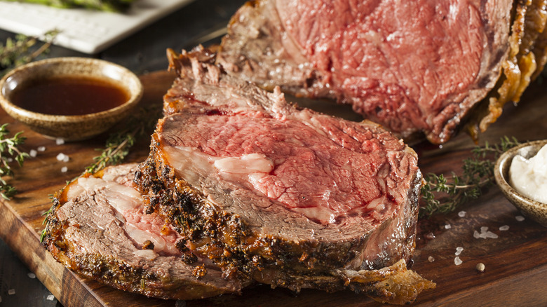 Sliced prime rib on wooden board