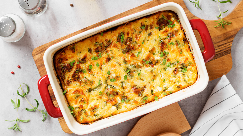 Casserole dish of cheesy baked spaghetti