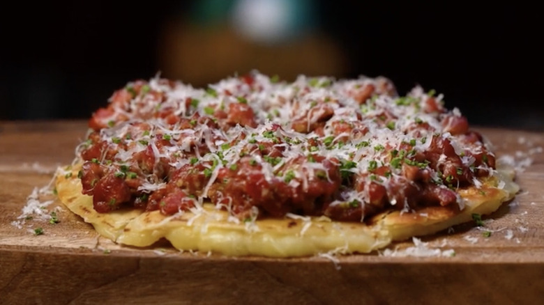 Steak tartare quesadilla on wooden board