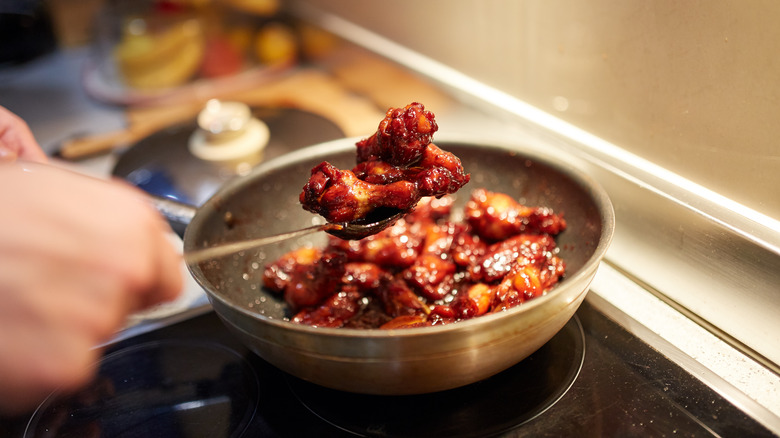 cooking chicken wings in wok