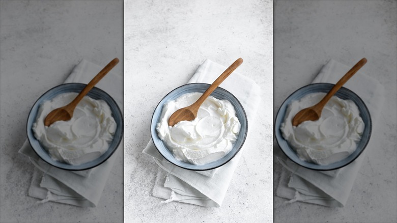 cream cheese in bowl with spoon