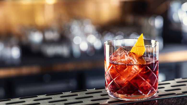 classic negroni in a cocktail glass on bar