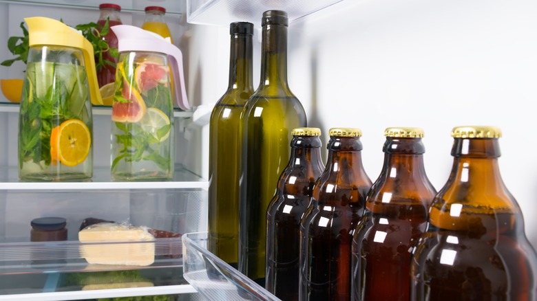 wine bottles on fridge door