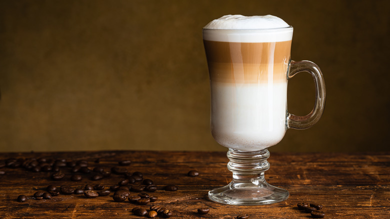 Latte macchiato served in tall glass