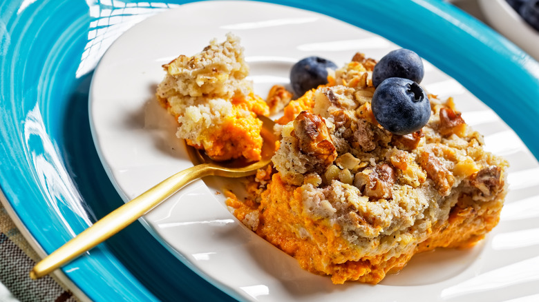 Close-up of a plated blueberry-topped dump cake