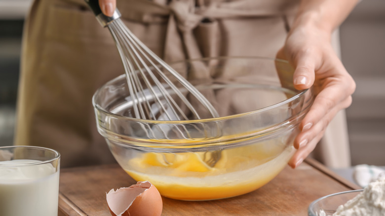 Chef whisking eggs