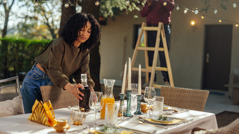 Woman setting the table