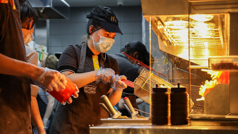 Fast food worker makes fries