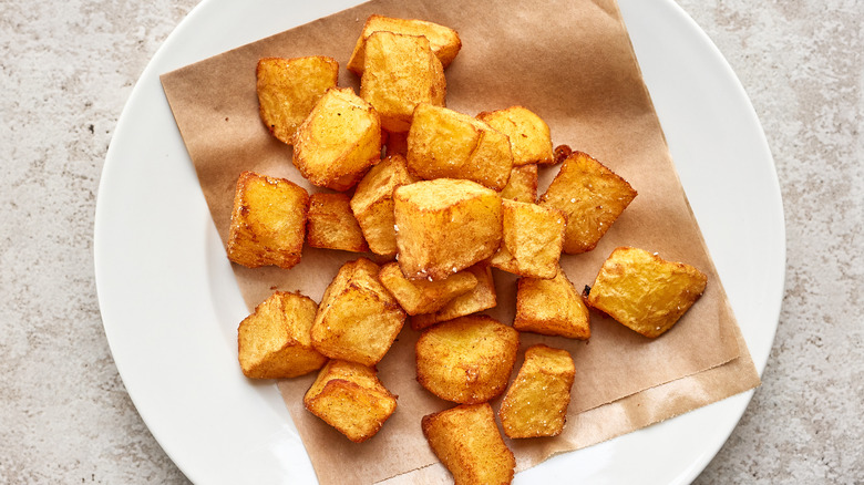 Crispy potatoes on parchment paper