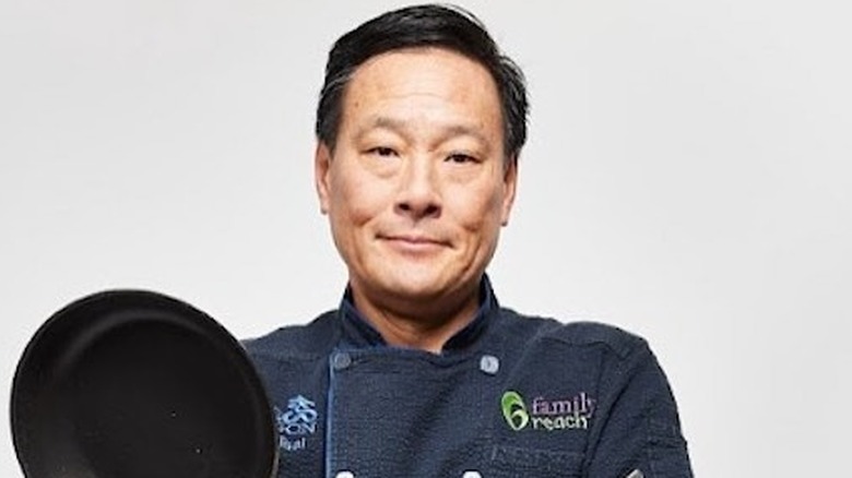 Chef Ming Tsai holding pan