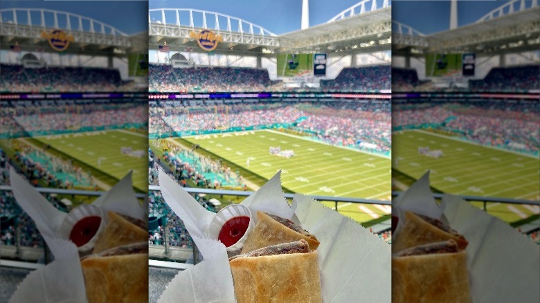 Person holding MingsBings at football stadium