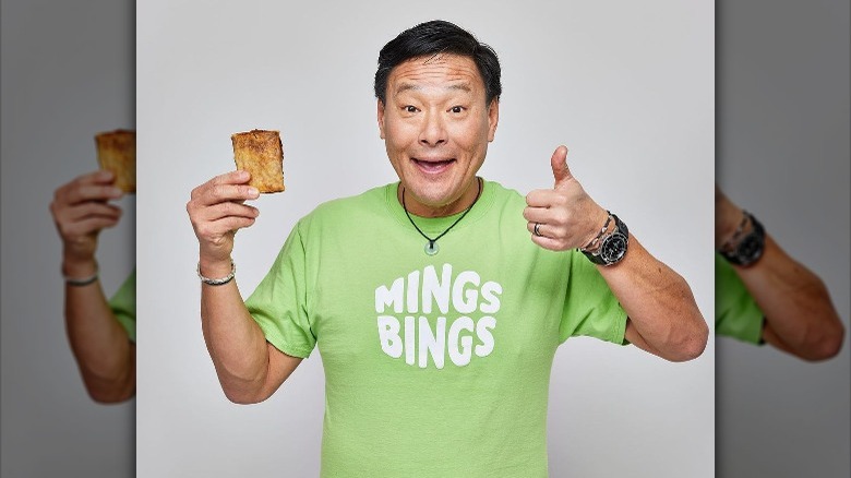 Ming Tsai holding a vegan bing