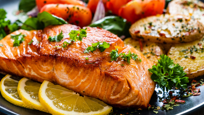 Salmon and vegetables on plate 