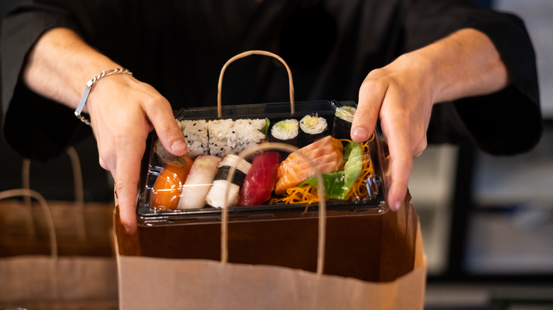 sushi in takeout container