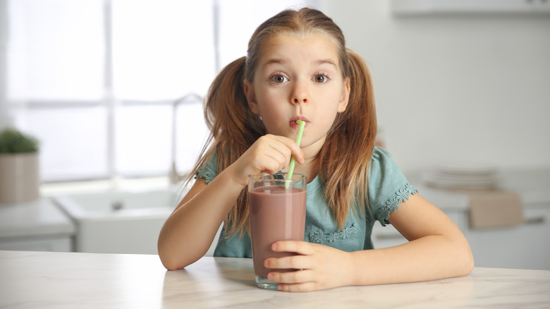 Child drinking chocolate milk