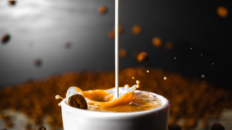 Creamer pouring in coffee