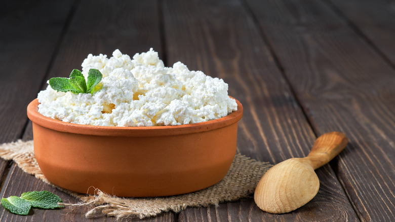 Cottage cheese in wooden bowl