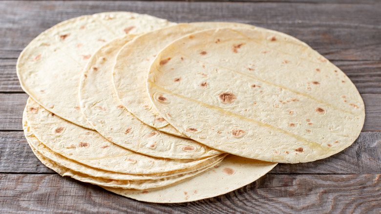 Wheat tortillas on gray background