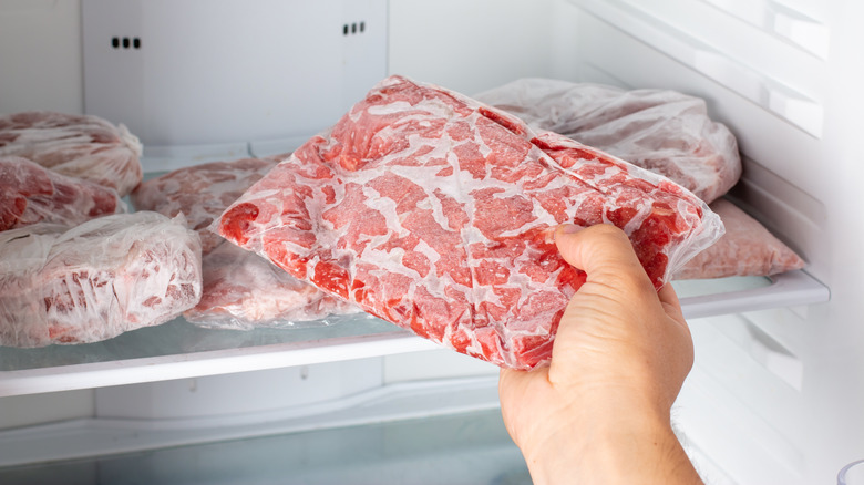 Frozen ground beef placed in freezer