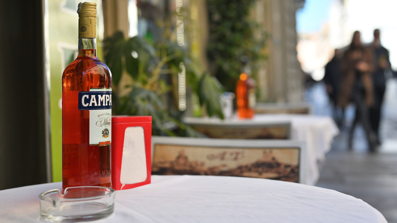 Bottle of Campari on a tabletop al fresco