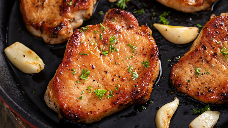 browned pork chop in pan