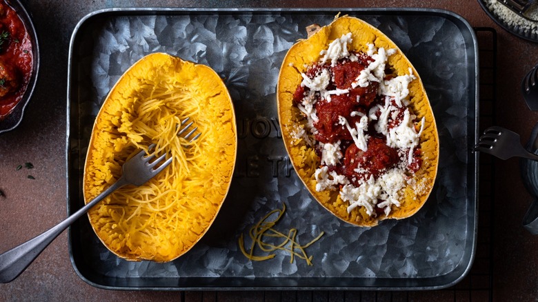 Spaghetti squash halves with and without pasta sauce