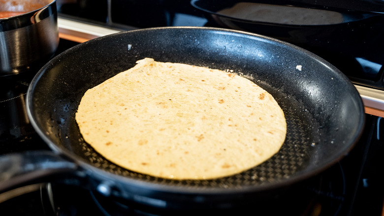 tortilla warming in a pan