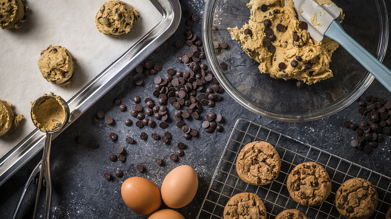 Chocolate chip cookies and dough on counter