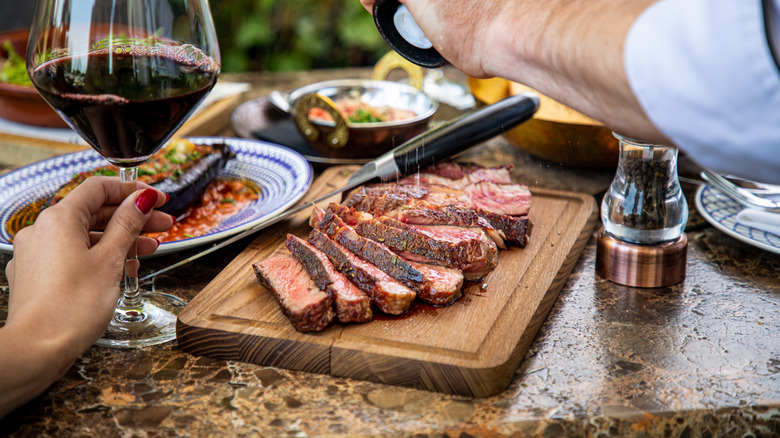 sliced steak on cutting board