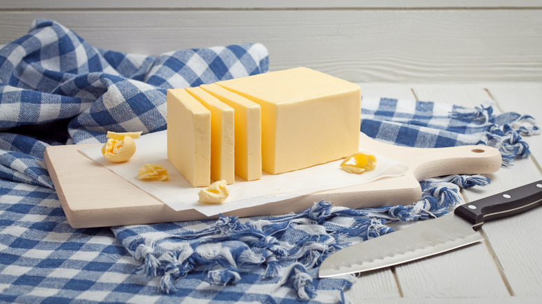 sliced butter on a cutting board 