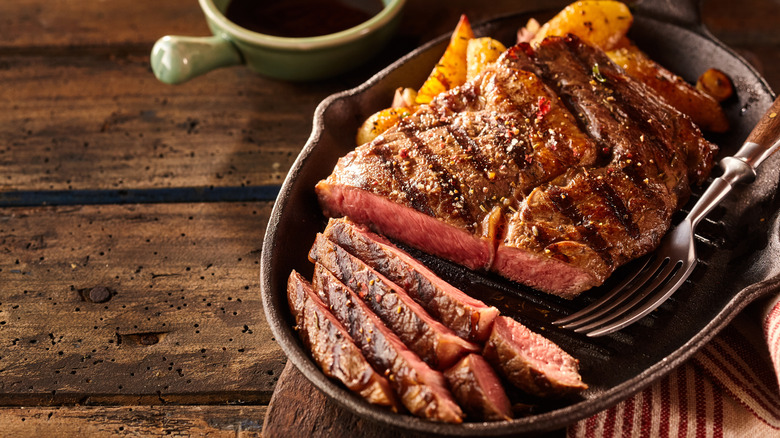 steak sliced on cast iron plate