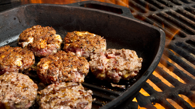 burgers cooking on skillet