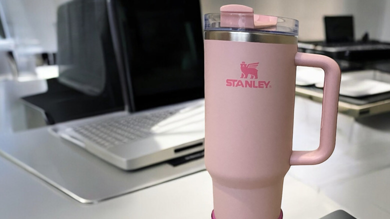 A Stanley tumbler on a counter