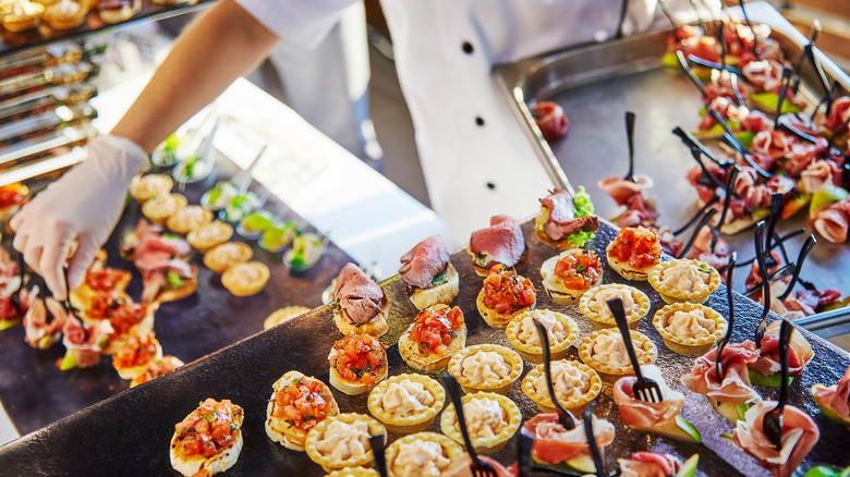 caterer laying out appetizers