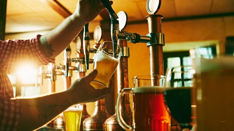 Bartender pouring draft beer