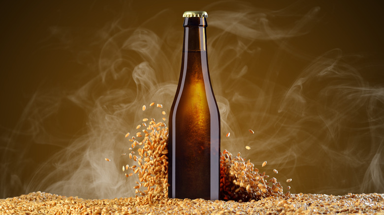 malt and beer bottle with smoke billowing