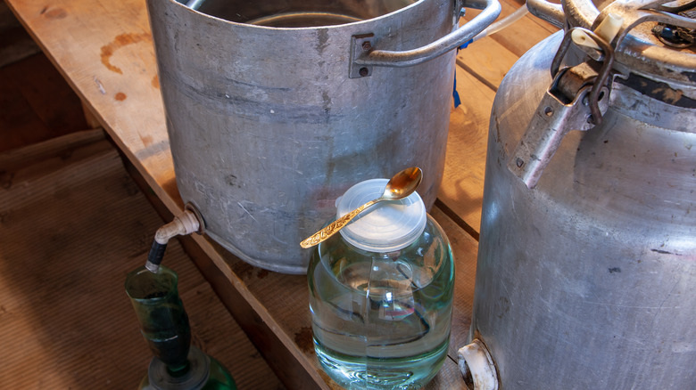 making moonshine with bucket